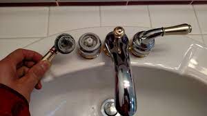 how to remove moen faucet handle without screws